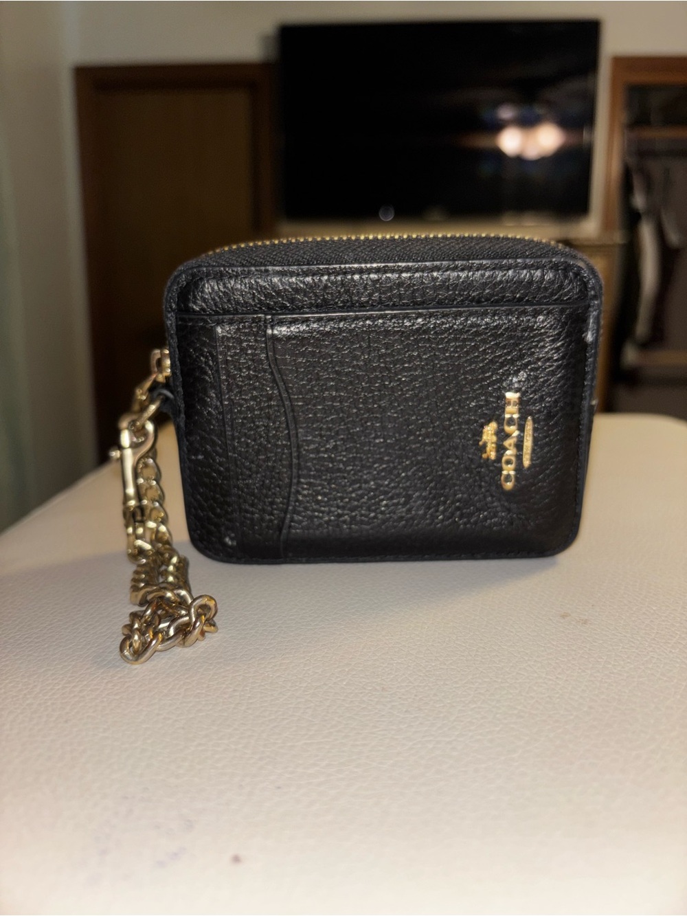 Coach Black Pebbled Leather Zip Card Case with Gold Chain Accent